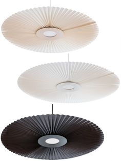 three different types of lamps hanging from the ceiling