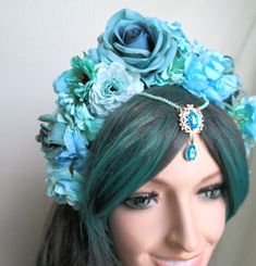 Blue fairy Flower Crown Fascinator. Blue Flower Headband Fascinator. Water Fairy, Fantasy, Mermaid. This spectacular, lush flower crown, is made of flowers, roses, a beautiful jeweled centerpiece. Feminine and pretty this headdress is ideal for making a statement. It can be a great addition to any fairy fantasy costume . Can be used as a pagan, carnival headpiece, for a garden weddingor tribal headpiece . It is lightweight, comfortable to wear and beautiful from the back view as well. Based upon Bohemian Blue Headpiece For Party, Blue Bohemian Headpieces For Party, Bohemian Blue Headpieces For Party, Blue Bohemian Party Headpiece, Whimsical Blue Costume Hats And Headpieces For Festival, Blue Headband With Handmade Flowers, Adjustable Blue Headpieces For Festivals, Adjustable Blue Festival Headpieces, Blue Handmade Flowers Headband