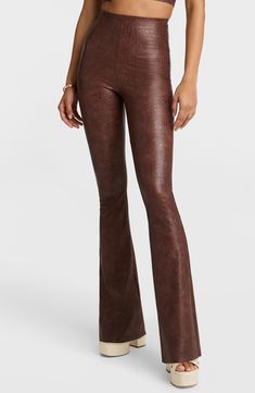 The brand's famous smoothing leggings get a head-turning makeover in this pair made from faux leather with a crocodile print and finished with flared hems. 34" length (size Medium) Pull-on style 97% viscose, 3% elastane with polyurethane coating Hand wash, line dry Made in the USA of imported fabric Leather Flare Pants, Stirrup Leggings, Flare Legging, Crocodile Print, Flare Leggings, Faux Leather Pants, Fabric Gifts, Free Fabric, Real Women