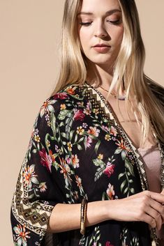 Stunning floral print with ethnic border featuring fine tassel kimono with side slits free size *100% Viscose *APPROX. L 37.50" W 39.5" Fringe L 7.50" 9.49oz *Imported Traditional Kimono For Spring Beach Cover-up, Spring Multicolor Tassel Shawl, Floral Print Shawl Kimono For Spring, Spring Floral Print Shawl Kimono, Bohemian Kaftan With Floral Print And Kimono Sleeves, Spring Shawl Kimono With Floral Print, Traditional Spring Kimono Shawl, Traditional Shawl Kimono For Spring, Beach Kimono With Tassels One Size