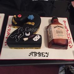 a birthday cake with a bottle of whiskey on it