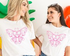 "Big Little Shirts Sorority Shirts Big Little Shirts Sorority Reveal Big Little Sorority Shirts Big Little Reveal Preppy Shirt Big Little Gifts Butterfly Shirt Big/Little Reveal QUICK  FACTS oBella Canvas 3001 Unisex T Shirt o100% Airlume combed and ringspun cotton  oLight Fabric. Retail fit. oTurn garment inside out. Wash and dry normally (on cool for best results). Do not dry clean. Do not iron. oActual product color may vary slightly from the listing photo due to monitor or mobile display. SIZING oAll items are unisex so runs like men's, although not overly large. oMost women find their typical size works best, since they are meant to fit a touch loose oSize guide and fit:  Size/Width/Length (inches) XS / 16.5\"/ 27\" S    /  18   / 28 M   /   20  / 29 L    /   22  / 30 XL  /  24   / 31 White Shirt With School Spirit For Spring, Pink Sorority T-shirt For Spring, White Sorority Tops With Letter Print, White Sorority Graphic Print T-shirt, White Short Sleeve Sorority Top, Pink Sorority T-shirt For Summer, Pink Short Sleeve Sorority Tops, Spring Sorority T-shirt With Graphic Print, Sorority Graphic Print T-shirt For Spring