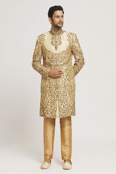 Gold sherwani with all-over zardozi and stone hand embroidery. Comes with gold pant. - Aza Fashions Semi-stitched Gold Kurta With Naqshi, Designer Gold Sets With Naqshi Detailing, Festive Gold Anarkali Set With Naqshi, Unstitched Gold Traditional Wear With Naqshi, Bollywood Style Gold Churidar With Naqshi, Festive Gold Anarkali Set With Naqshi Detail, Bollywood Gold Churidar With Naqshi, Gold Sherwani With Zari Work For Designer Wear, Gold Sherwani With Resham Embroidery And Kundan