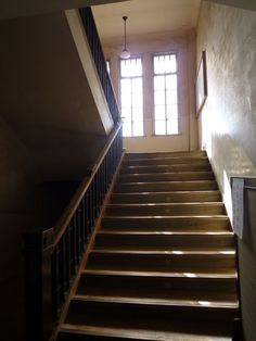 an empty staircase leading up to the second floor