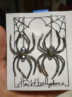 the spider earrings are made out of plastic