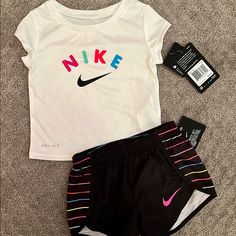 Adorable Bright & Colorful Nike Dri-Fit Outfit! Brand New, Tags Attached. Size: 2t Fast Shipping! (I Ship Daily, Except For Sundays And Holidays) Check Out My Other Listings For More Amazing Finds. I Am Always Happy To Bundle So You Can Save $$. If You Are Interested In Bundling On Multiple Items, Please Make Sure To Message Me Before Purchasing So I Can Set Up A Custom Listing For You. Comes From A Pet & Smoke Free Home. Thanks For Shopping & Stopping By!! Playful White Nike T-shirt, White Nike Summer Sets, Nike White Summer Sets, Nike Sporty White Sets, White Graphic Print Sets For Playtime, White Nike Playwear Sets, Nike White Sets For Spring, Nike Summer Tops, Nike White Short Sleeve Sets