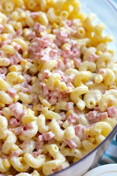 a bowl filled with macaroni and cheese on top of a table