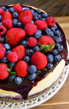 a cake with berries and blueberries on top