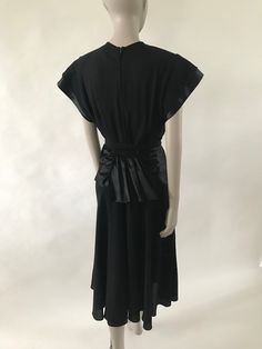 "Gorgeous 1940's black crepe cocktail dress with satin waist belt and satin sleeve details. Matching Crepe belt is a bit brittle. Metal zipper up the back and waist gather in the back. Size medium: Bust: 38\" Waist: 28\" Hips: max 48\" 47.5\" shoulder to hem Belt: 36\" long" Daphne Scooby Doo Costume, Black Crepe Dress, Daphne Costume, Crepe Dress, Metal Zipper, Sleeve Detail, Belt Size, Waist Belt, Striped Shirt