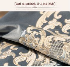 the fabric has gold and black designs on it