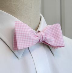 Men's Bow Tie, pink and white mini gingham bow tie, pink white bow tie, gingham bow tie, wedding bow tie, groom bow tie, groomsmen gift, This elegant tie in pink and white mini gingham check will enhance any ensemble and any occasion you care to wear it. Suitable for the office but also a wonderful color for weddings and other social occasions. The self tie cotton bow tie has a hook for easy removal that allows the tie to remain intact if you prefer not to tie it every time you wear it. Adjustab Pink Bow With Bow Tie Back For Wedding, Dapper Bow Tie For Spring Weddings, Dapper Spring Bow Tie For Weddings, Pink Bow Tie For Summer Formal Events, Dapper Spring Wedding Bow Tie, Pink Bowtie As Gift, Pink Bow Tie For Black Tie Events, Pink Bow Tie For Spring Formal Occasions, Pink Bow Tie For Spring Formal Events