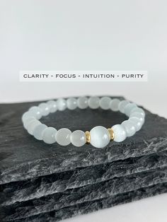 💎 MATERIAL DETAILS ○ 8mm + 10mm Selenite → clarity, focus, purity, and dispels negative energy ○ 6mm 18k gold plated spacers ○ High quality, resistant, and flexible elastic cord (double-corded) 💯 QUALITY & CRAFTSMANSHIP ○ Materials are handpicked, inspected, and handled with the utmost quality and care ○ Double-corded with high quality elastic cord - this means our bracelets have 2x the durability of other stretch bracelets!  ○ Seamless knotting technique which ensures each stretch bracelet knot is concealed ○ Please kindly note natural stones may vary in appearance as they are all uniquely formed ○ Handcrafted with ♡ from our studio in Toronto, Canada 📏 SIZING ○ All bracelets include an additional 0.5in relative to your wrist size for the best fit ○ Measure your wrist by wrapping strin Cheap White Stretch Bracelet For Meditation, White Crystal Bracelet, Bracelet Knot, Eye Bead Bracelet, Knotting Technique, Eye Meaning, Spiritual Cleansing, Beaded Necklace Diy, Energy Bracelets