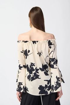 This printed floral top is the epitome of high-low fashion. Made from luxurious satin fabric, this piece features an elegant off-the-shoulder neckline and elastic shirring at the waist. Its long sleeves with ruffled cuffs elevate the top’s contemporary style. DETAILS & CARE 100% Polyester Satin Off shoulder Long sleeves with ruffled cuffs Unlined Hand wash in cold water with like colors Do not bleach Hang to dry in the shade Do not tumble dry Low iron only if needed Do not dry clean Wash garment Spring Evening Off-shoulder Top, Evening Off-shoulder Top For Spring, Feminine Off-shoulder Top For Spring Evenings, Casual Off-shoulder Top For Evening, Summer Long Sleeve Off-shoulder Top With Blouson Sleeves, Summer Off-shoulder Top With Blouson Sleeves, Elegant Off-shoulder Blouse For Spring, Elegant Off-shoulder Spring Blouse, Elegant Summer Long Sleeve Off-shoulder Top