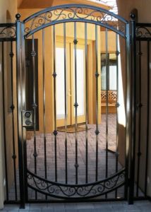 an iron gate in front of a doorway