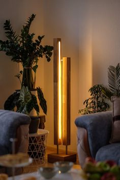 a living room filled with furniture and a tall lamp