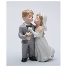 a figurine of a bride and groom kissing