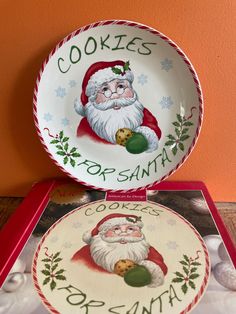 two christmas plates with santa's cookies on them