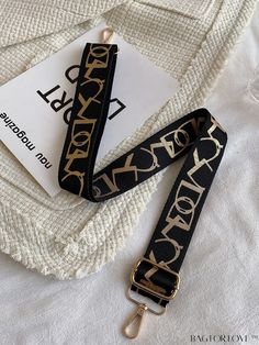 BagForLove - Printed Bag Strap â Adding a Stylish Touch Product Description Color Black Pattern Type Geometric Material Polyamide Composition 100% Nylon Details Pictures Similar Products h2 { text-align: center; } /* æ¢è¡ */ li{ white-space: normal; word-break: break-all; word-wrap: break-word; } .red-box { width: 100%; display: flex; flex-direction: row; flex-wrap: wrap; justify-content: center; } .red-box > div { width: 190px; height: 250px; margin: 10px; } .red-box > div > a > img { width: 190px; height: 250px; } .size-box { width: 100%; margin: auto; white-space: nowrap; } .table { border-collapse: collapse; border-spacing: 0; width: 100%; table-layout: fixed; } tr, td, th { border: 1px solid rgb(175, 173, 173); padding: 10px 0px; text-align: center; font-size: 14px; box-sizing: bo Gold Bags With Strap For Daily Use, Trendy Bags With Logo Strap, Gold Travel Bag With Long Strap, Gold Crossbody Bag With Long Strap, Black Rectangular Casual Bag Strap, Casual Black Bag Strap With Long Strap, Casual Black Bag With Long Strap, Casual Black Rectangular Bag Strap, Casual Black Long Bag Strap