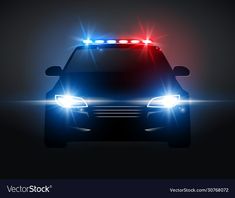 a police car with its lights on in the dark