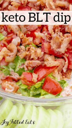 a salad with lettuce, tomatoes and bacon in it