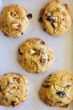 six cookies are on a baking sheet ready to be baked in the oven or used as an appetizer