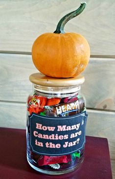 a jar filled with candy and a pumpkin