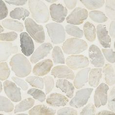 a white and gray stone floor with small rocks