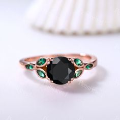 7mm Round Cut Black Onyx Engagement Ring,Marquise Shaped Emerald Ring May Birthstone,14k Rose Gold Ring,Anniversary Ring For Women,Art Deco Black Onyx Promise Bridal Ring Main Ring Metal Type: 14k Rose Gold ( Yellow/White Gold, Platinum, Silver Only, Rose/White/Yellow Gold Plated is available ) Center Stone: 7mm Round Cut Black Onyx Side stone: 3x1.5mm Marquise Shaped Lab-created Emerald Prongs pave halo set ★Size: US3-10 (If your ring size is lower than 3 or larger than 10,please contact me fir Black Birthstone Rings For Anniversary, Black Birthstone Rings, Oval Black Emerald Ring For Anniversary, Black Oval Emerald Gemstone Ring, Black Emerald Rings As A Gift, Black Oval Emerald Ring, Elegant Black Emerald Round Ring, Black Emerald Gemstone Ring For Anniversary, Black Band Emerald Ring For Promise