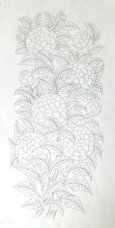 a drawing of flowers and leaves on paper