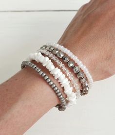 Beaded layered statement cuff bracelet white and gray beads and stones. White Round Beads Bracelets For Layering, White Stacked Bohemian Beaded Bracelets, Adjustable Stacked White Beaded Bracelets, Adjustable White Stacked Beaded Bracelets, Adjustable White Beaded Bracelets For Layering, Locket Earrings, Statement Cuff Bracelet, Beaded Cuff Bracelet, Memory Wire Bracelet