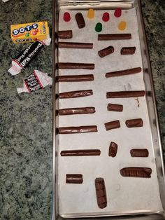 chocolate candy bars are arranged on a baking sheet and ready to go into the oven