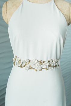 "CORA SASH- GOLD DESCRIPTION Romantic Boho Ivory Hand Made Floral Cutout Metal Gold Leaf & Crystal Vine Wedding Dress Belt Satin Bridal Sash by Camilla Christine - Measures 11\" long by 2\" wide - Ivory Satin Sash Measures 1 1/2\" Wide by 90\" Long - Made of Off White Georgette Flowers, Gold Metal Leaves and Clear Crystals - Ships in 3-5 Business Days - Also Available in Silver (See Separate Listing) - Coordinating Headpiece Also Available (See See Separate Listing) ---------------------POLI Elegant Embroidered Bridal Belt For Wedding, Elegant Gold Bridal Belt, Elegant Gold Sashes With Embroidered Belt, Bridal Belts And Sashes Gold, Elegant Gold Embroidered Bridal Belt, Crystal Ship, Wedding Dress Belt, Satin Sash, Crystal Trim