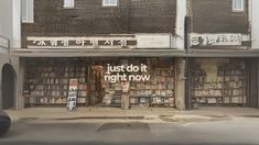 an old building with many books on the front and side windows that say just do it right now