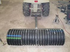 an image of a vehicle that is made out of rubber tires and pipes on the ground