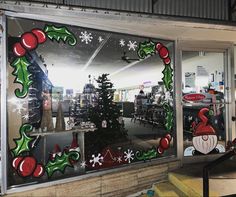 a store window decorated with christmas decorations