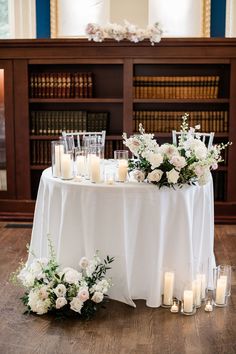 a table with candles and flowers on it