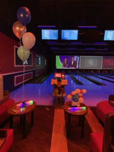 a bowling alley filled with lots of bowling balls