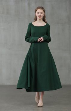 "Linennaive specialises in luxury basics to elevate the everyday. Dark, daring and dramatic - what more could a lady ask for? we finds the beauty in dark romance. Expert craftsmanship and premium materials are introduced to this edgy design vision. This green wool dress features an elegant U shape neckline, draped skirt, long sleeves, gathering details, a fitted silhouette, and a long length. 【Details】 luxurious 100% wool fabric. the color is warm and soft. two deep side pockets, longsleeves 330 Green Winter Dresses, Librarian Style, Pregnancy Clothes, Edgy Design, Royal Outfits, Draped Skirt, Winter Mode, Nice Style, Winter Dress