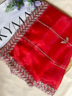 Elevate your traditional Indian attire with our exquisite Red Tissue Organza Dupatta. This stunning piece features intricate handwork adorned with real glass beads and diamond embellishments, showcasing the unparalleled craftsmanship of our skilled artisans. Each dupatta takes 8 days to complete, ensuring the highest quality and attention to detail. Key Features: Material : Luxurious Red Tissue Organza Craftsmanship : Handcrafted with real glass beads and diamond work Size : Generous 2.35 meters Tissue Dupatta, Organza Dupatta, Indian Attire, Traditional Indian, 8 Days, Timeless Pieces, Scarf Accessory, Embellishments, Glass Beads