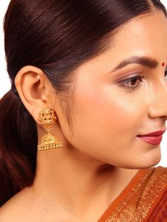 Crafted from 925 silver with a lustrous gold polish, this Jhumka showcases a traditional design. The stud section is elegantly adorned with a Lakshmi motif, while the round floral-designed Jhumka with dangling elements exudes opulence, adding substantial value to this exquisite piece. Please refer to the pictures of the jewelry worn on a model to get a clear idea of the size. Condition: New. This product is intricately designed and meticulously handcrafted with exceptional care by our skilled si Traditional 22k Gold Bridal Earrings For Festive Occasions, Traditional Dual-tone Danglers, Dual-tone Chandbali Jewelry For Puja, Elegant Chandbali Jhumkas For Navratri, Meenakari Round Earrings For Puja, Meenakari Earrings For Puja, Round Shape, Round Meenakari Earrings For Puja, Meenakari Earrings For Puja, Traditional Bridal Earrings With Intricate Design For Navratri