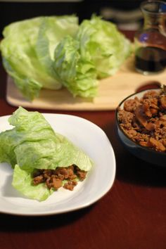 lettuce and meat are on the table ready to be eaten