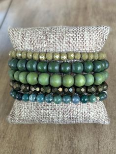 Dare to be adventurous with the Green Goddess Bracelet Stack! This bold, monochromatic stack features wood and sparkle for a daring touch of style. Two options for this stack! both stacks: same 4 bracelets: army green 00000076 Indian Agate 74200000 evergreen wood 76700000 avocado wood 25800000 Stack 1: 00000014 Olive Green Stack 2: 44100000 light sage Goddess Bracelet, Be Adventurous, Indian Agate, Green Goddess, Bracelet Stack, Jewelry Ideas, Army Green, Olive Green, Avocado