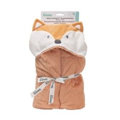 an orange and white fox towel wrapped around it's face