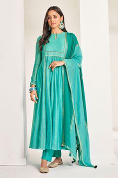 Sea green soft chanderi anarkali with pita and resham embroidery. Comes with pant and a gota lace work dupatta.
Components: 3
Pattern: Embroidered
Type Of Work: Pita, Resham, Gota lace
Neckline: Round
Sleeve Type: Full
Fabric: Soft chanderi, Lining: Chanderi
Color: Green
Other Details: 
Attached lining
Length:
Anarkali: 52 inches
Sleeves: 23 inches
Pant: 38 inches
Dupatta: 2.5 mtrs
Occasion: Mehendi and Haldi - Aza Fashions Green Chanderi Anarkali Set With Dabka, Green Slub Silk Anarkali Set With Straight Kurta, Green Slub Silk Anarkali Traditional Wear, Green Anarkali Traditional Wear In Slub Silk, Green Anarkali Palazzo Set In Mulmul, Green Slub Silk Anarkali Set For Diwali, Green Resham Embroidered Anarkali Set In Mulmul, Green Slub Silk Anarkali Set With Dabka Work, Designer Green Anarkali Set In Mulmul