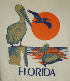 there is a white shirt with a bird on it and the sun in the background