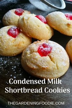 some cookies that are on top of a pan with the words, condenseed milk shortbread cookies