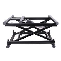 a black metal table with two trays on it