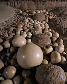 an image of rocks and pebbles on the beach