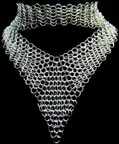 The **ValorGuard Aluminum Chainmail Necklace** is a stunning statement piece designed for women who appreciate bold, yet elegant jewelry. Crafted from lightweight, hypoallergenic aluminum, this choker-style neckpiece features intricately woven chainmail links that offer both strength and beauty. Its shimmering, polished finish adds a touch of warrior-like grace to any outfit, making it perfect for those who love to blend classic charm with modern edge. Ideal as a unique gift for your wife or gir Diy Chainmail, Spike Choker, Chainmail Necklace, Gothic Lace, Spider Jewelry, Chainmail Jewelry, Chain Maille Jewelry, Lace Set, Choker Style