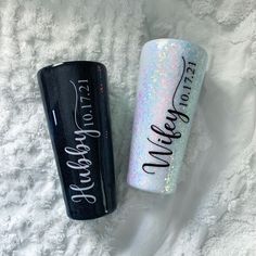 two glitter lip bales sitting next to each other on top of a white blanket